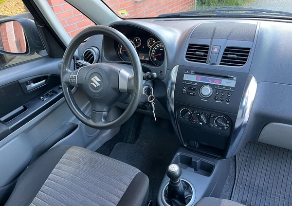 Suzuki SX4 cena 26900 przebieg: 153000, rok produkcji 2012 z Borne Sulinowo małe 254